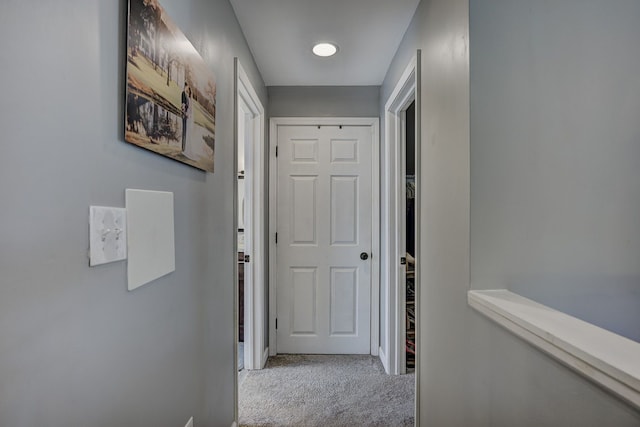 hall with carpet flooring and baseboards