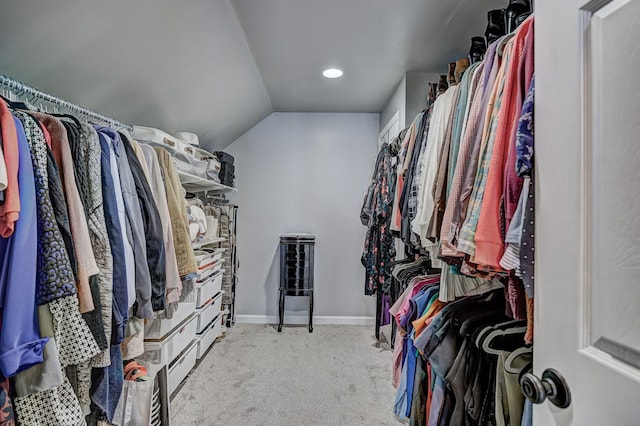 spacious closet with carpet and lofted ceiling