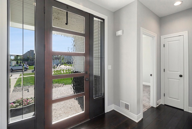 entryway featuring baseboards, dark wood finished floors, and recessed lighting