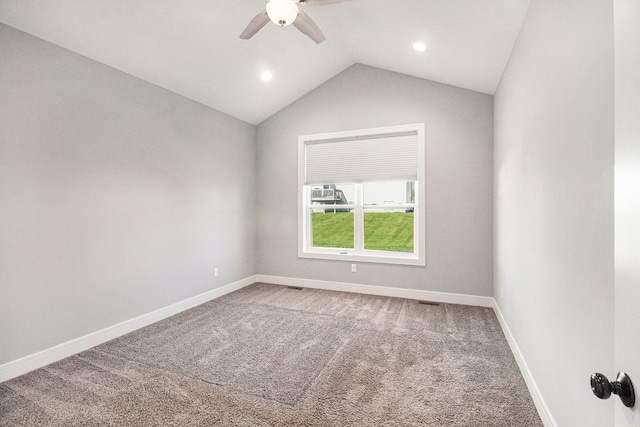 spare room with ceiling fan, carpet, lofted ceiling, baseboards, and recessed lighting