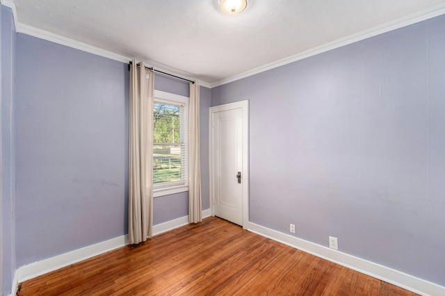 22619 Santa Maria St, Detroit, MI 48219 - empty room featuring baseboards, wood finished floors, and crown molding