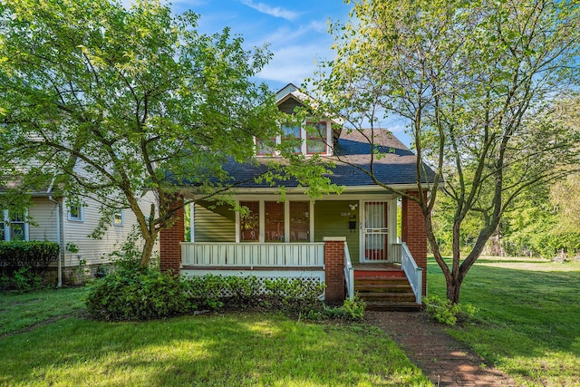 22619 Santa Maria St, Detroit, MI 48219 - view of front of home featuring covered porch, a front lawn, and roof with shingles