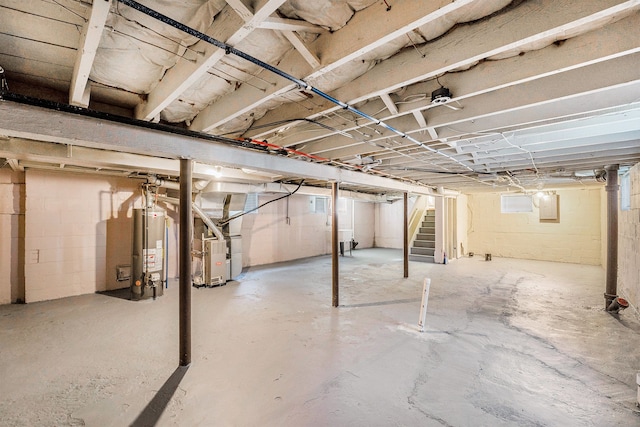 22619 Santa Maria St, Detroit, MI 48219 - unfinished basement with gas water heater, stairs, heating unit, and electric panel