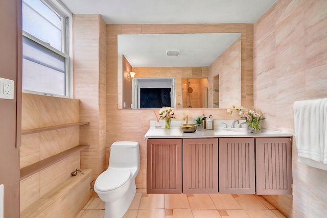 full bathroom featuring tile walls, tile patterned flooring, toilet, a shower with shower door, and vanity