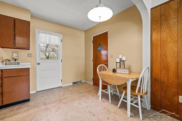 301 W Fourth St, Gladwin, MI 48624 - dining area with baseboards and arched walkways