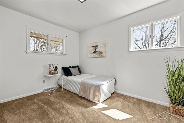 301 W Fourth St, Gladwin, MI 48624 - bedroom with carpet flooring and baseboards
