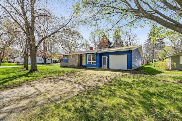 301 W Fourth St, Gladwin, MI 48624 - ranch-style home with an attached garage, a chimney, a front yard, and driveway