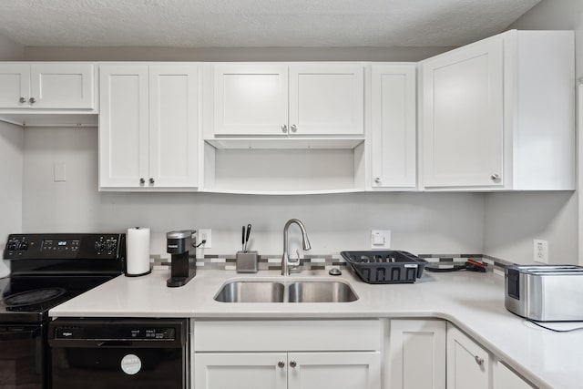 1430 New York Ave, Lansing, MI 48906 - kitchen featuring a sink, black appliances, and white cabinetry