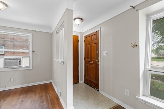 9319 Merriman Rd, Livonia, MI 48150 - entrance foyer with cooling unit, baseboards, and hardwood / wood-style flooring