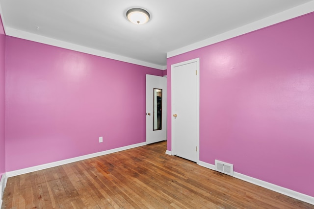 9319 Merriman Rd, Livonia, MI 48150 - empty room featuring hardwood / wood-style flooring and baseboards