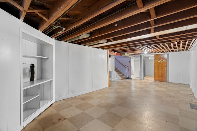 9319 Merriman Rd, Livonia, MI 48150 - finished basement featuring tile patterned floors and stairway