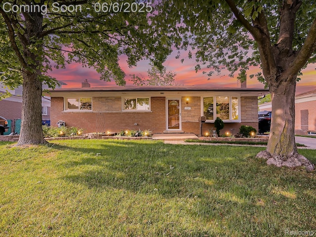 13327 Murthum Ave, Warren, MI 48088 - single story home with a chimney, a lawn, and brick siding