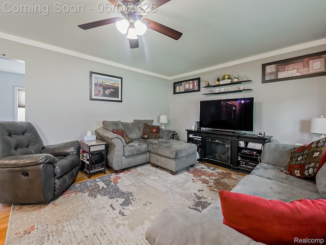 13327 Murthum Ave, Warren, MI 48088 - living area featuring ceiling fan, wood finished floors, and crown molding