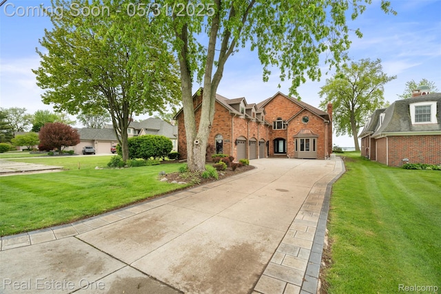 48556 Harbor Dr, Chesterfield, MI 48047 - view of front of house with brick siding, driveway, an attached garage, and a front yard