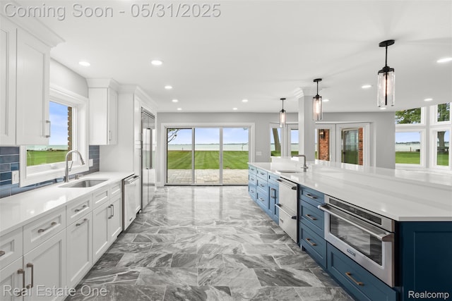 48556 Harbor Dr, Chesterfield, MI 48047 - kitchen featuring a sink, healthy amount of natural light, white cabinetry, and recessed lighting