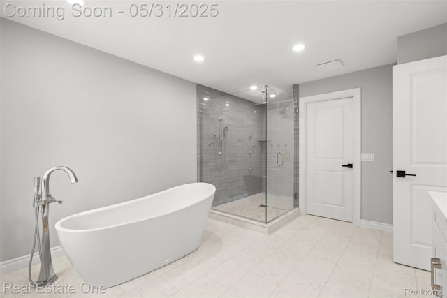 48556 Harbor Dr, Chesterfield, MI 48047 - full bathroom featuring a shower stall, a freestanding tub, recessed lighting, baseboards, and vanity