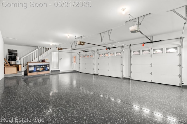 48556 Harbor Dr, Chesterfield, MI 48047 - garage with a garage door opener and baseboards