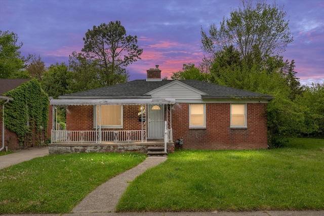 9035 Braile St, Detroit, MI 48228 - bungalow-style home featuring a porch, brick siding, a front yard, a chimney, and roof with shingles