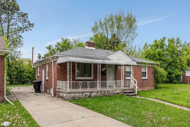 9035 Braile St, Detroit, MI 48228 - bungalow featuring a porch, a front yard, brick siding, a chimney, and driveway