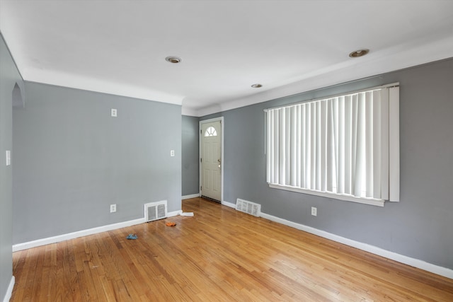 9035 Braile St, Detroit, MI 48228 - unfurnished room featuring baseboards, hardwood / wood-style floors, and arched walkways