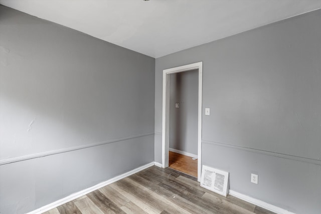 9035 Braile St, Detroit, MI 48228 - empty room with wood finished floors and baseboards