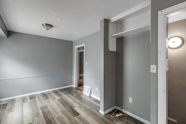 9035 Braile St, Detroit, MI 48228 - unfurnished bedroom featuring wood finished floors and baseboards