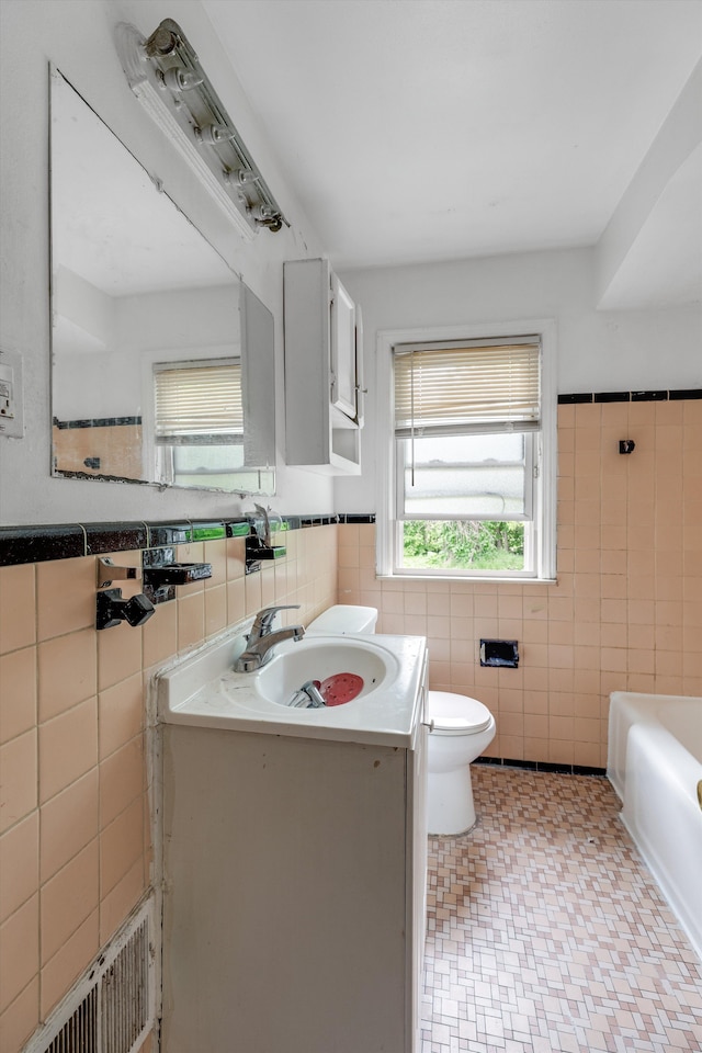 9035 Braile St, Detroit, MI 48228 - full bath featuring tile walls, toilet, a bathtub, vanity, and wainscoting