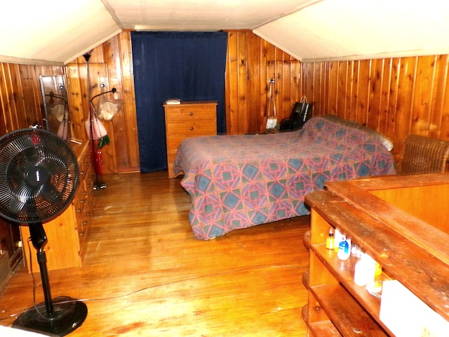 9546 Westwood St, Detroit, MI 48228 - bedroom featuring wood walls, lofted ceiling, and wood finished floors