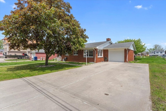 30617 Young Dr, Gibraltar, MI 48173 - ranch-style home with an attached garage, brick siding, a front lawn, concrete driveway, and a chimney