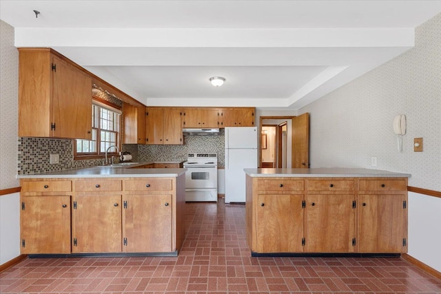 30617 Young Dr, Gibraltar, MI 48173 - kitchen featuring electric range, freestanding refrigerator, wallpapered walls, a peninsula, and baseboards