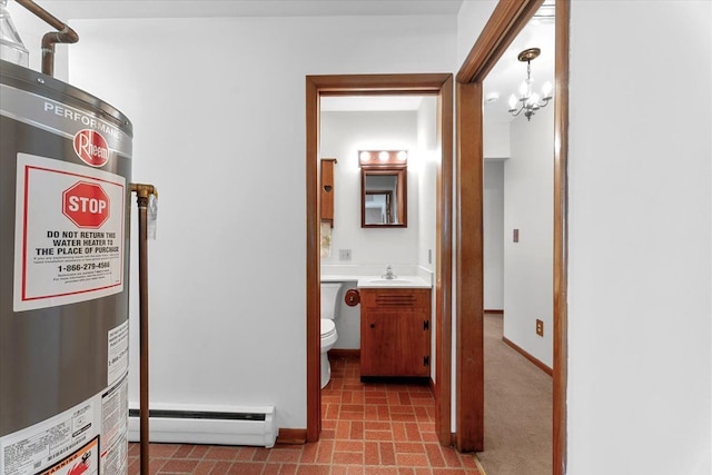 30617 Young Dr, Gibraltar, MI 48173 - corridor featuring gas water heater, baseboard heating, a chandelier, and baseboards