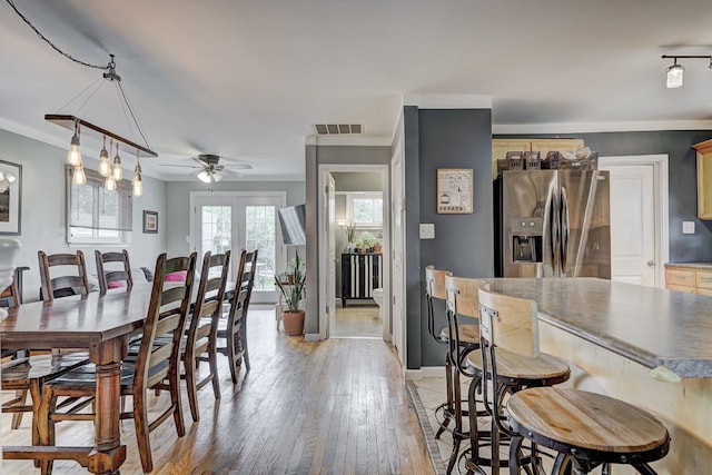 2230 Princeton Rd, Berkley, MI 48072 - dining area featuring a ceiling fan, light wood-style flooring, baseboards, and ornamental molding