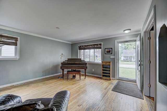 2230 Princeton Rd, Berkley, MI 48072 - living area with hardwood / wood-style flooring, ornamental molding, baseboards, and beverage cooler