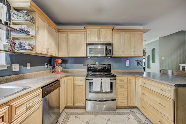2230 Princeton Rd, Berkley, MI 48072 - kitchen with stainless steel appliances, light brown cabinets, light tile patterned floors, a peninsula, and ornamental molding