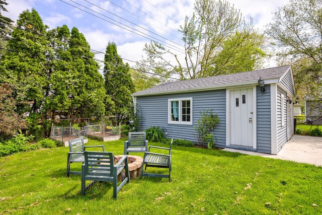 2230 Princeton Rd, Berkley, MI 48072 - view of yard with a vegetable garden, an outdoor structure, and a garage