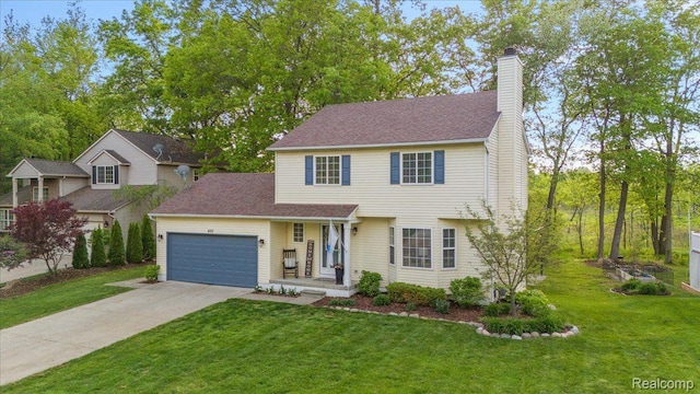 457 Cove View Dr, Waterford, MI 48327 - view of front of home featuring an attached garage, a chimney, driveway, and a front yard