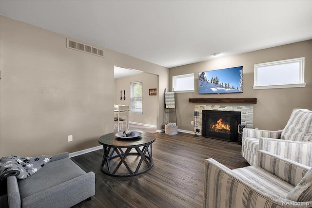 457 Cove View Dr, Waterford, MI 48327 - living area featuring dark wood-style floors, baseboards, and a stone fireplace