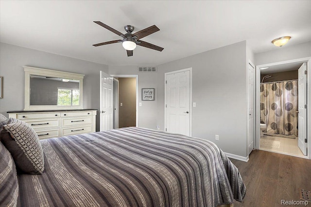 457 Cove View Dr, Waterford, MI 48327 - bedroom featuring dark wood-style floors, baseboards, connected bathroom, and ceiling fan