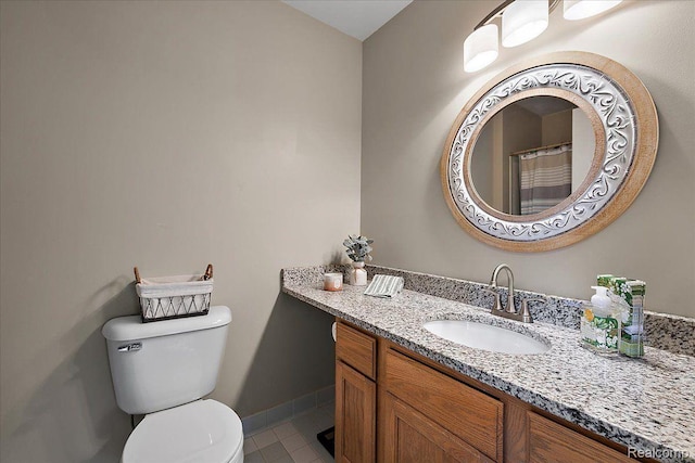 457 Cove View Dr, Waterford, MI 48327 - full bath featuring vanity, toilet, tile patterned floors, and baseboards
