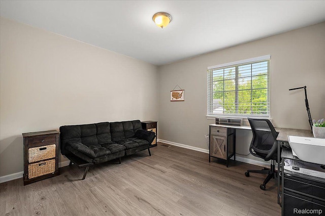 457 Cove View Dr, Waterford, MI 48327 - office area featuring light wood-style flooring and baseboards