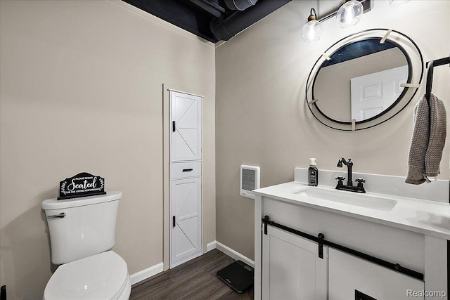 457 Cove View Dr, Waterford, MI 48327 - half bath featuring vanity, toilet, wood finished floors, and baseboards