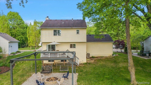 457 Cove View Dr, Waterford, MI 48327 - back of house with a fire pit, a wooden deck, a yard, and a chimney