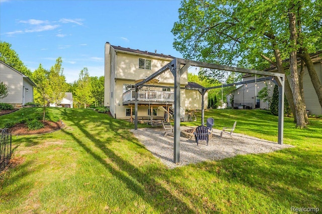 457 Cove View Dr, Waterford, MI 48327 - back of house featuring a fire pit, a wooden deck, a patio area, and a yard