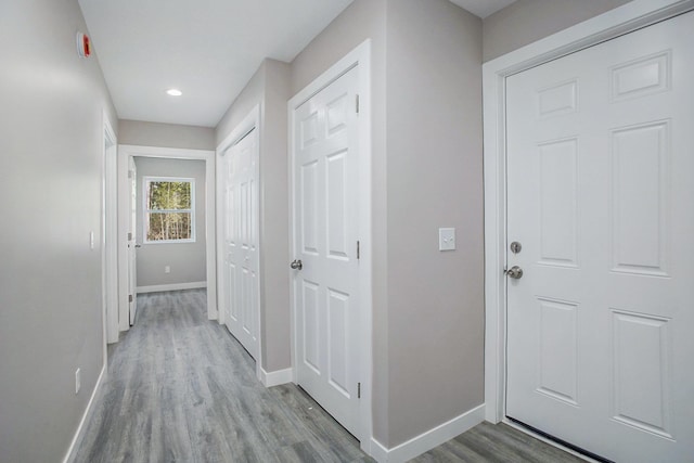 5203 NE Myers Rd, Kalkaska, MI 49646 - hallway with baseboards, wood finished floors, and recessed lighting