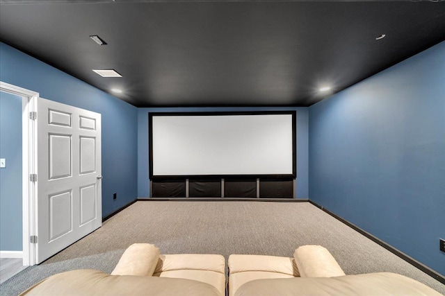 cinema room featuring baseboards and carpet floors