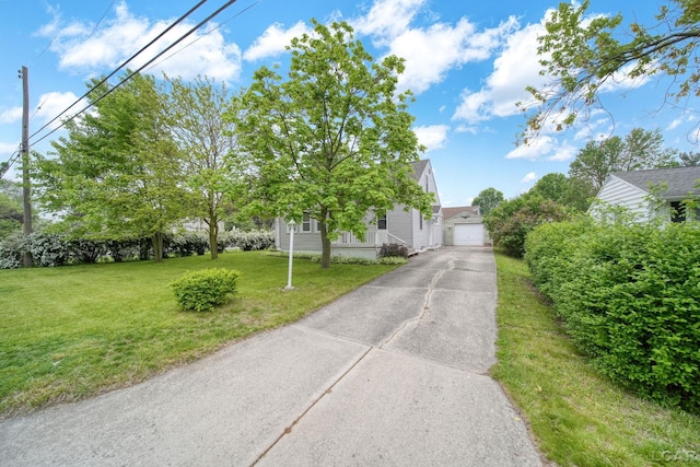 1107 Sunset Dr, Tecumseh, MI 49286 - obstructed view of property with a front yard and a garage