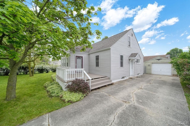 1107 Sunset Dr, Tecumseh, MI 49286 - view of front of house featuring a front lawn, a shingled roof, driveway, a garage, and an outdoor structure