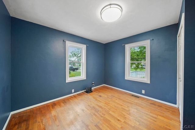 1107 Sunset Dr, Tecumseh, MI 49286 - empty room featuring wood finished floors and baseboards