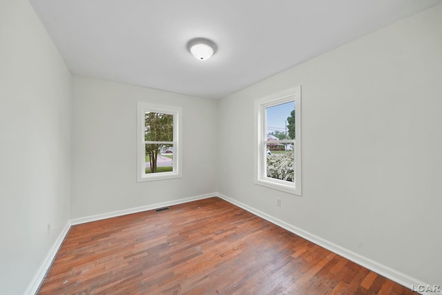 1107 Sunset Dr, Tecumseh, MI 49286 - unfurnished room with baseboards and wood finished floors