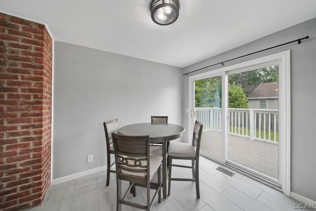 1107 Sunset Dr, Tecumseh, MI 49286 - dining area featuring baseboards